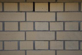 a big wall with yellow bricks