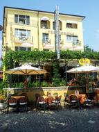tables outside under umbrellas