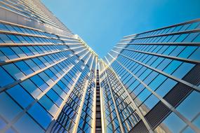 skyscraper with glass facade under the blue sky