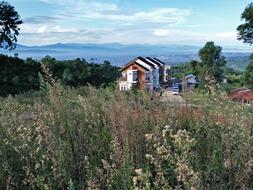 Beautiful Indonesian landscape with the colorful house, among the colorful plants