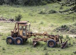 tractor by the green grass