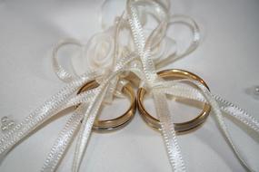 long ribbons with gold rings