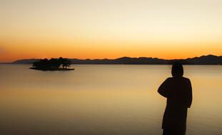 man silhouette sea