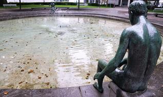 depressed man sitting, Statue at Fountain, switzerland, zurich