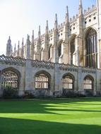 Beautiful, old school, with the green lawn, in sunlight and shadow, in the United Kingdom