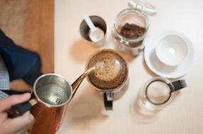 man pours coffee