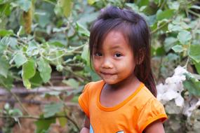 Cute Little asian child girl outdoor, laos