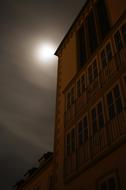 moon over the building of an abandoned school