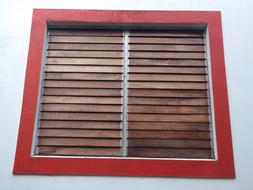 wooden window with red frame