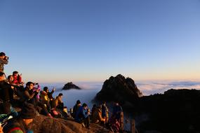 people mountains clouds sky view