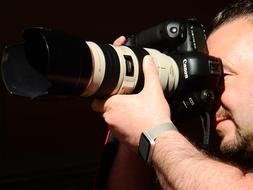 macro photo of a man with a professional camera