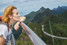 Tourist Woman looking at mountains