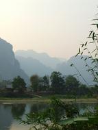 lake with mountains on the trees