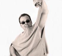 Man with sunglasses and in torn sweater at white background