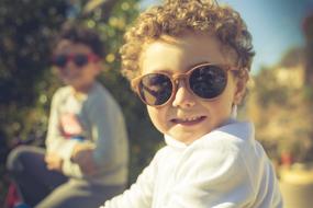 picture of a happy child wearing sunglasses