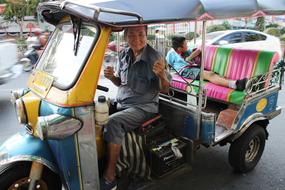 driver in Tuk Tuk Thailand car