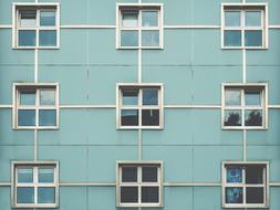 windows on blue Architecture Building wall