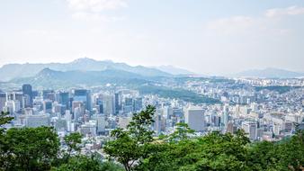 panoramic view of the city in the haze among the mountains