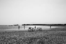Bikes and People on beach, Silhouettes