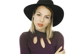 beautiful blonde girl in a black hat