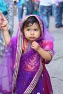 Portrait of the girl covered in colorful clothing