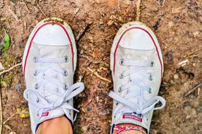 white converse sneakers on the ground