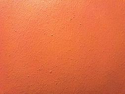 Close-up of the orange wall, in light and shadow