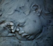 sleeping angel of stone