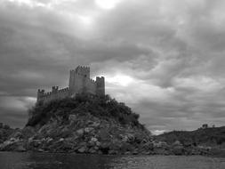 monochrome photo of unusually beautiful Almourol Castle