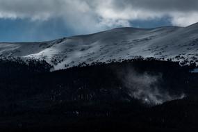 big rocky mountain in the snow