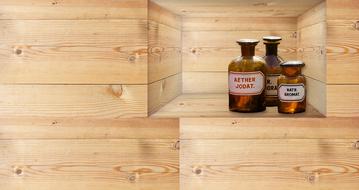 aroma oils in bottles on a wooden shelf