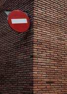 road sign on a brick facade