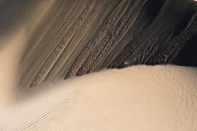 falling sand from above