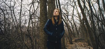 Girl in winter forest