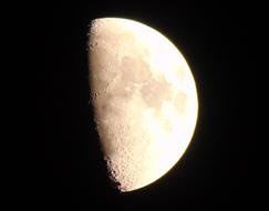 half a white moon on a black background.