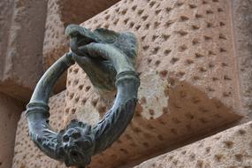 metal decorations on the facade of a palace in grenada