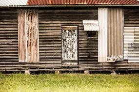 old wooden grass building