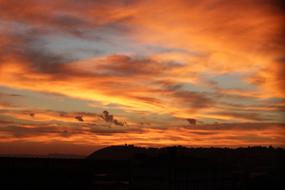 orange sunset by the clouds