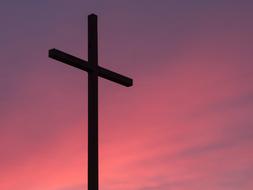 black cross with pink clouds