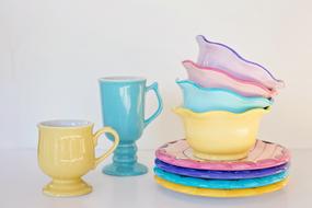 colored plates and mugs on the table