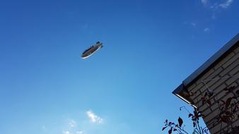 an airplane in the big blue sky