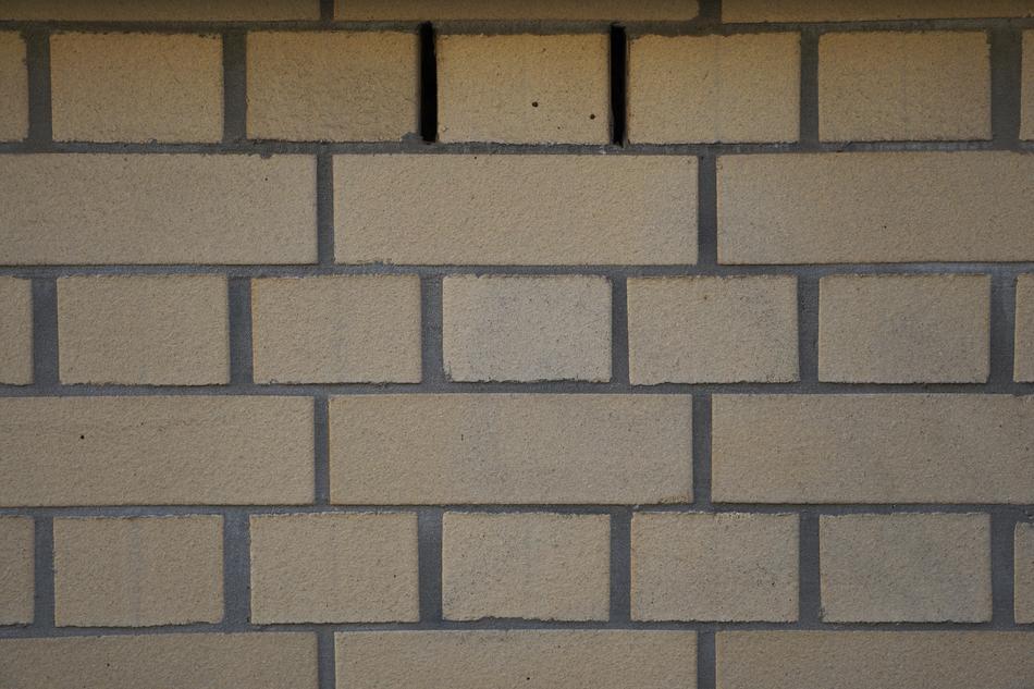 a big wall with yellow bricks