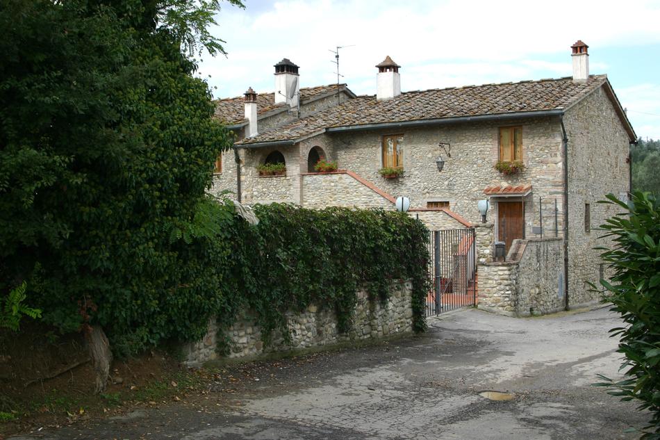 stone house leaves tree pole