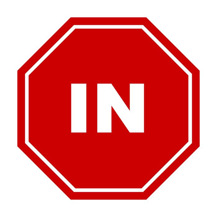 in, white letters at red octagon