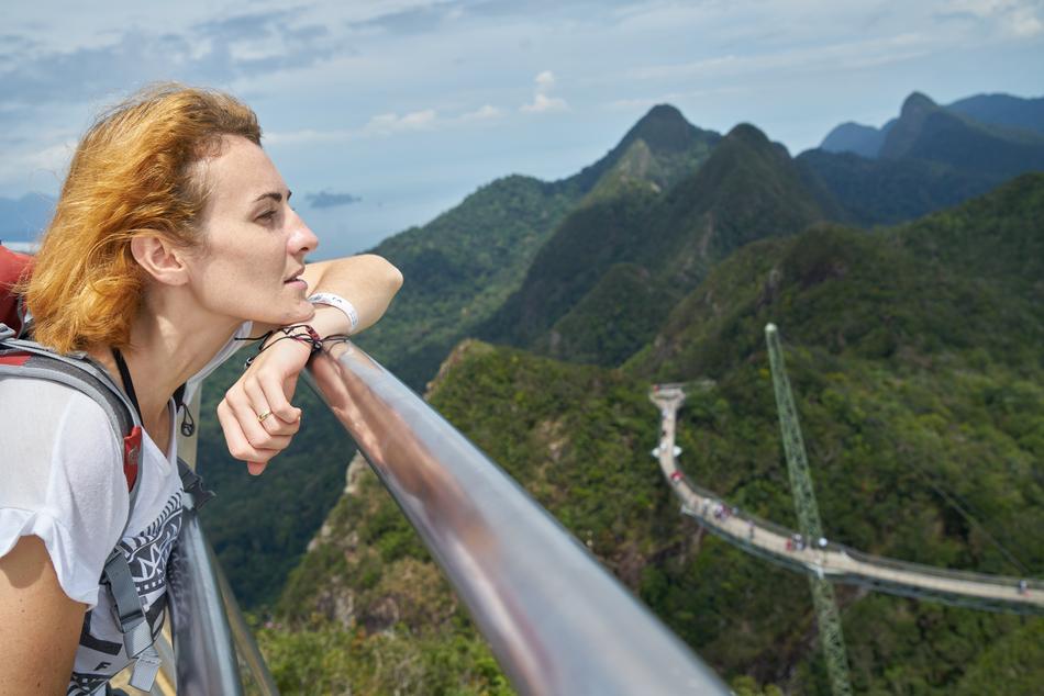 Tourist Woman looking at mountains