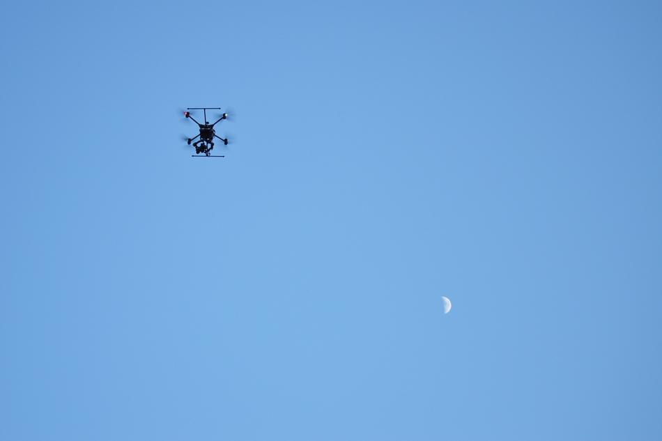 quadcopter in blue sky on a sunny day