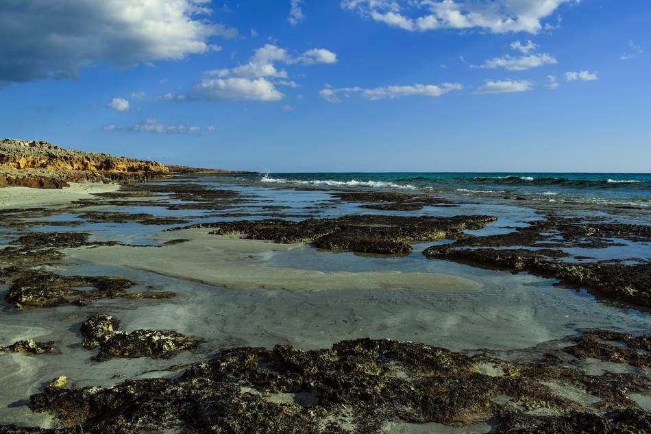 lake with rocks with sky