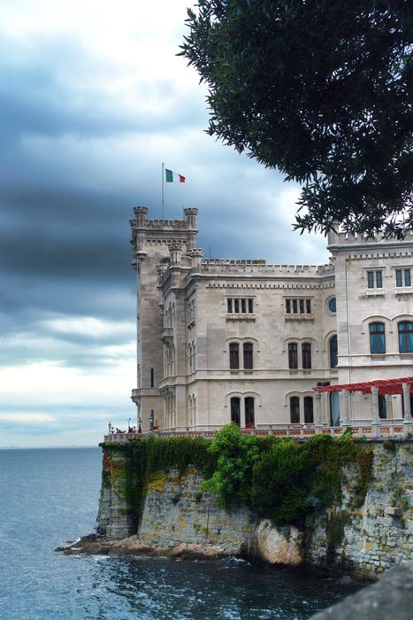 a large building on an island by the sea