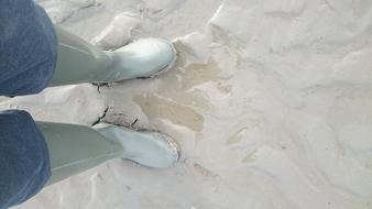 white boots on the beach