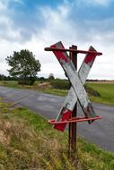 white red cross on the road